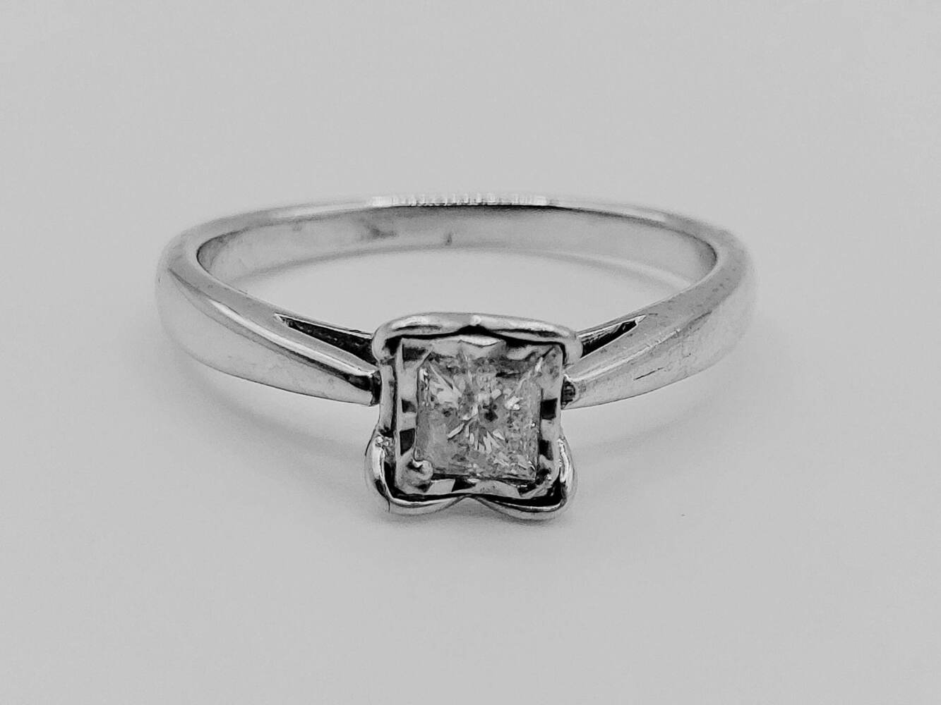 Lady's 10 Karat White Gold Princess Cut Solitaire in Heart Shaped Claws