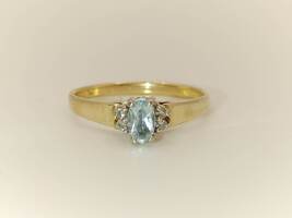 Lady's 10 Karat Yellow Gold Ring with Light Blue Oval Ring