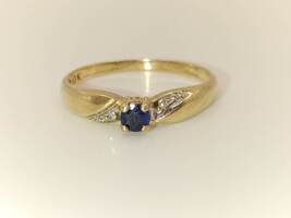 Lady's 10 Karat Yellow Gold Ring with Dark Blue Stone