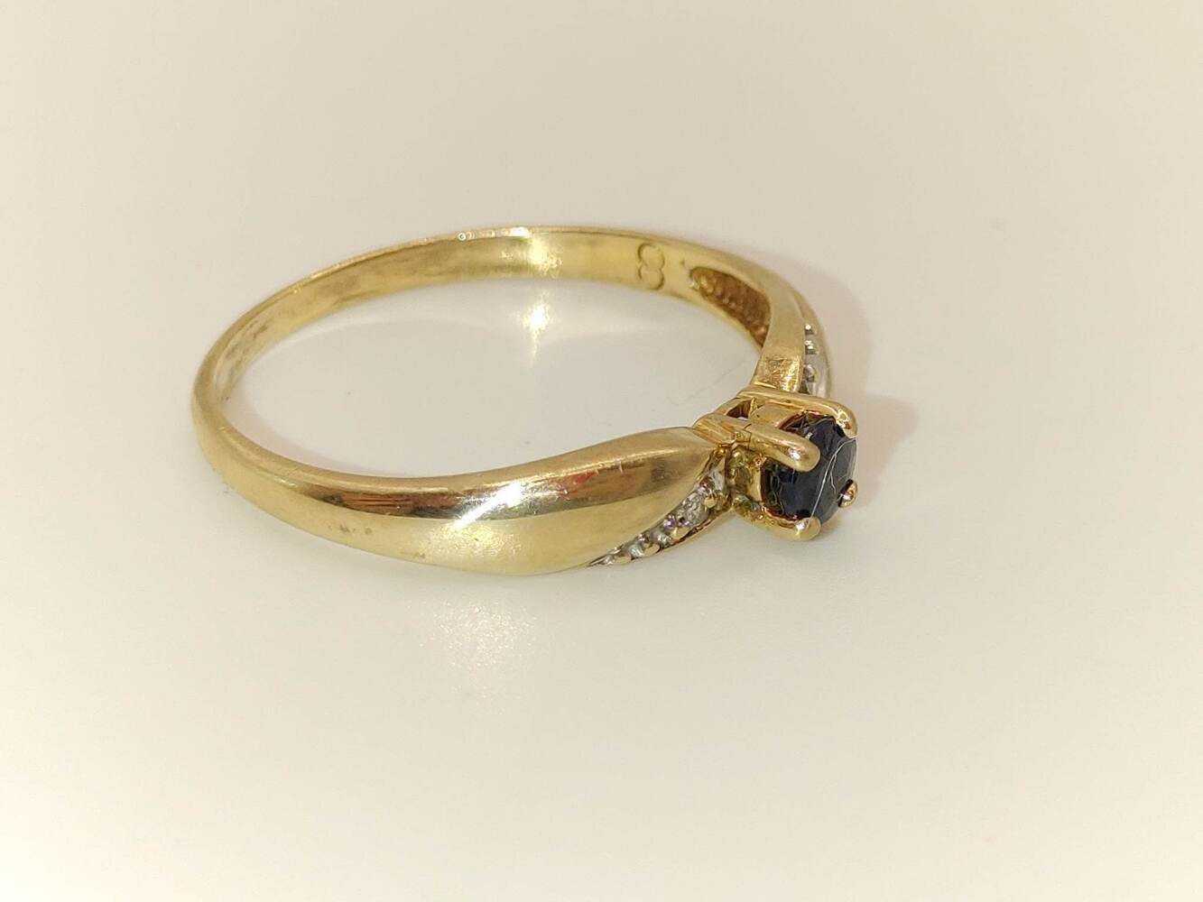 Lady's 10 Karat Yellow Gold Ring with Dark Blue Stone