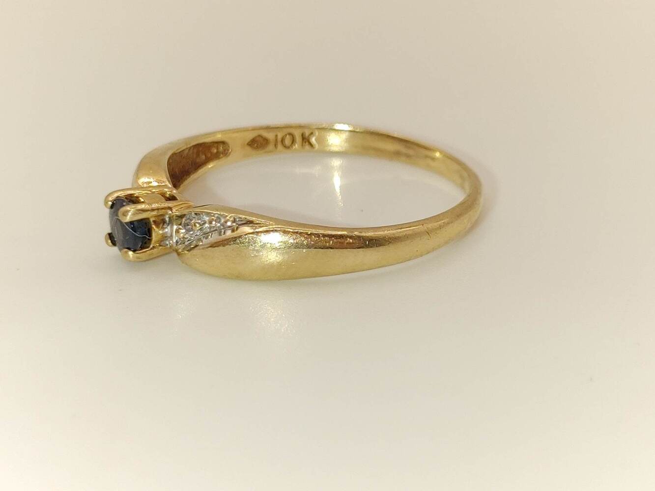 Lady's 10 Karat Yellow Gold Ring with Dark Blue Stone