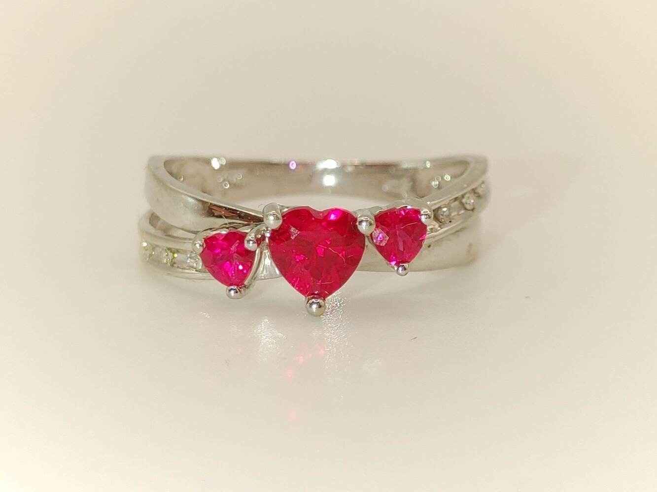 Lady's 10 Karat White Gold Ring with Deep Pink Heart Stones