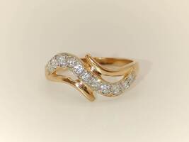 Lady's 14 Karat Rose Gold Everyday Wear Band with Clear Stones