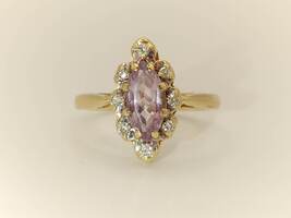 Lady's 10 Karat Yellow Gold Purple Marquise Stone with Small Diamond Chips