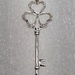 14 Karat White Gold Key With 30 Round Clear Stones Pendant