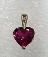 10 Karat Yellow Gold Red Gemstone Heart & A Round Clear Stone Pendant