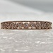 10 Karat Rose Gold Band With 11 Clear Stone Filled Heart Accents - Size 7