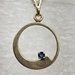 14 Karat Yellow Gold 1 Round Blue Gemstone Circle Pendant