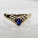 10 Karat Yellow Gold Blue Marquise Cut Gemstone & 6 Clear Stones - Size 5.5