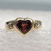 10 Karat Yellow Gold Red Heart Ring With 2 Round Clear Stones - Size 3.5