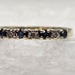 10 Karat Yellow Gold Band With 4 Blue Gemstones & 3 Clear Stones - Size 6