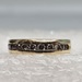 14 Karat Yellow Gold Clear Stone Channel Set Ring - Size 4
