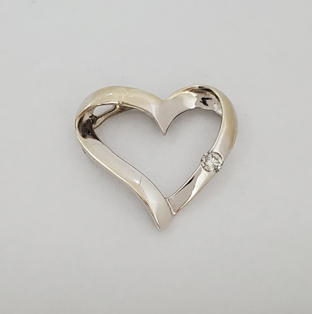 10k White Gold Diamond Open Heart Pendant Approximate t.c.w. 0.05